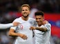 England's Harry Kane celebrates scoring their third goal with teammate Jadon Sancho on November 14, 2019