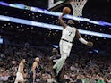 Boston Celtics guard Jaylen Brown (7) goes in for a dunk past Dallas Mavericks guard Tim Hardaway Jr. (11) during the fourth quarter at TD Garden on November 12, 2019