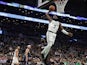Boston Celtics guard Jaylen Brown (7) goes in for a dunk past Dallas Mavericks guard Tim Hardaway Jr. (11) during the fourth quarter at TD Garden on November 12, 2019