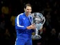 pain's Rafael Nadal celebrates with the ATP World No.1 trophy after winning his group stage match against Greece's Stefanos Tsitsipas on November 15, 2019