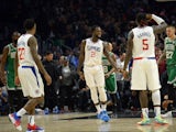 Los Angeles Clippers guard Patrick Beverley (21) reacts after shooting a three point basket against the Boston Celtics with forward Montrezl Harrell (5) and guard Lou Williams (23) during overtime at Staples Center on November 21, 2019