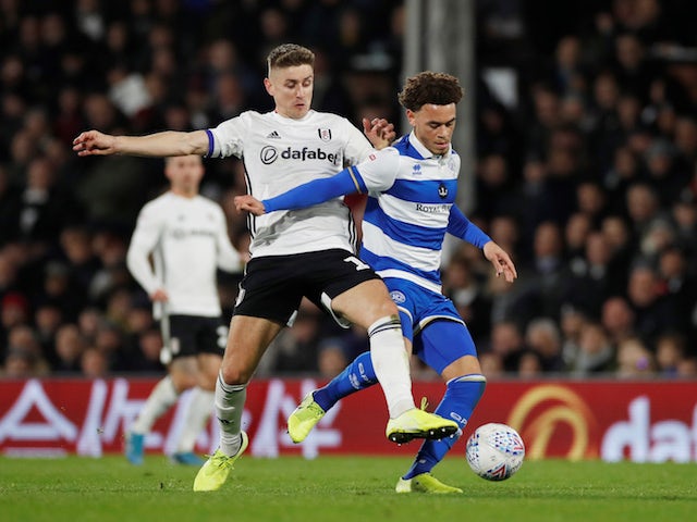 Fulham's Tom Cairney in action with QPR's Luke Amos in the Championship on November 22, 2019
