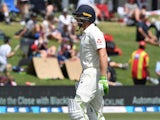 England's Jos Buttler walks off the pitch dejected after his wicket is taken by New Zealand's Neil Wagner on November 22, 2019