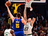 Denver Nuggets center Nikola Jokic (15) attempts over Boston Celtics forward Daniel Theis (27) in the second quarter at the Pepsi Center on November 23.