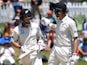 New Zealand's Mitchell Santner and BJ Watling walk off at lunch on November 24, 2019