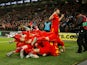 Wales' Aaron Ramsey celebrates scoring their second goal with Ben Davies and teammates on November 19, 2019