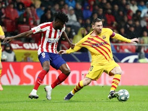 Messi scores late as Barca overcome Atletico