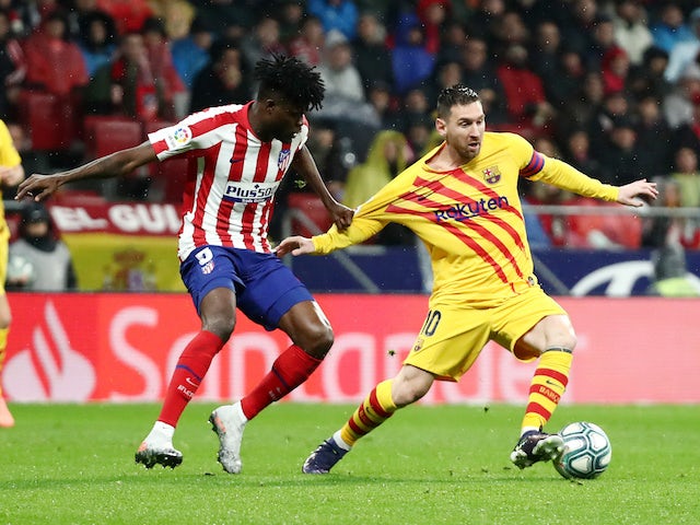 Barcelona's Lionel Messi in action with Atletico Madrid's Thomas Partey in La Liga on December 1, 2019