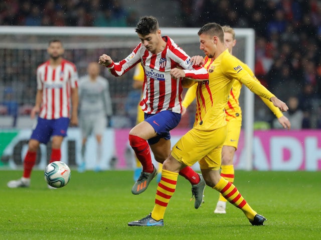 Barcelona's Clement Lenglet in action with Atletico Madrid's Alvaro Morata in La Liga on December 1, 2019