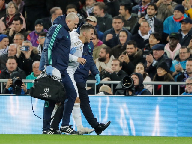 Real Madrid's Eden Hazard limps off with an ankle injury against Paris Saint-Germain in the Champions League on November 26, 2019.
