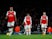 Arsenal's Mesut Ozil and Granit Xhaka look dejected after Brighton & Hove Albion's Neal Maupay scored their second goal on December 5, 2019
