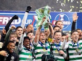 Celtic's Scott Brown celebrates winning the Scottish League Cup Final with teammates on December 8, 2019