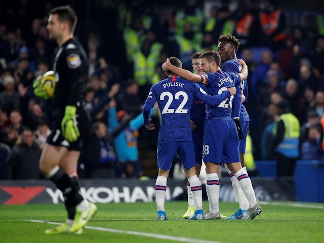 Chelsea's Tammy Abraham celebrates scoring their first goal with teammates as Aston Villa's Tom Heaton looks dejected on December 4, 2019