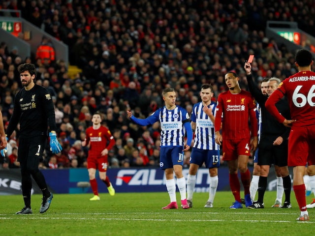 Liverpool's Alisson is shown a red card by referee Martin Atkinson on November 30, 2019