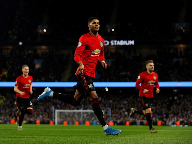 Marcus Rashford celebrates scoring the opener during the Premier League game between Manchester City and Manchester United on December 7, 2019