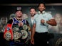Andy Ruiz Jr and Anthony Joshua pose for a photo in front of promoter Eddie Hearn during the press conference on December 4, 2019