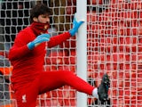 Alisson Becker warms up for Liverpool on December 14, 2019