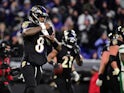 Baltimore Ravens quarterback Lamar Jackson (8) celebrates after throwing a touchdown pass in the fourth quarter against the New York Jets at M&T Bank Stadium on December 13, 2019
