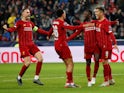 Liverpool's Naby Keita celebrates scoring their first goal with Roberto Firmino and teammates on December 10, 2019