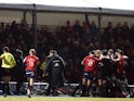 Munster medic Jamie Kearns (L) with referee Pascal Gauzere as players including Saracens' Jamie George clash on December 14, 2019