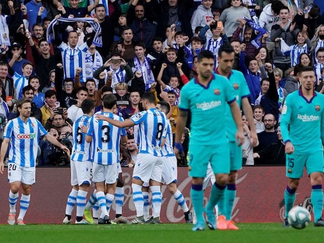 Real Sociedad's Mikel Oyarzabal celebrates scoring their first goal with teammates on December 14, 2019