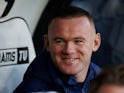 Derby County player coach Wayne Rooney watches the match from the bench on November 30, 2019