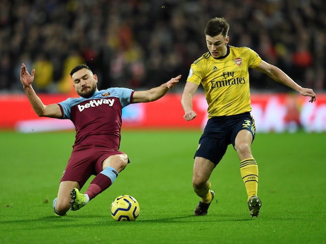 Arsenal's Kieran Tierney in action with West Ham United's Robert Snodgrass in the Premier League on December 9, 2019