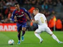 Barcelona's Nelson Semedo in action with Real Madrid's Toni Kroos in La Liga at Camp Nou on December 18, 2019