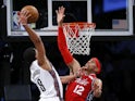 Brooklyn Nets guard Spencer Dinwiddie (8) goes up for a dunk against Philadelphia 76ers forward Tobias Harris (12) during the second half at Barclays Center on December 16, 2019
