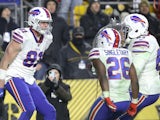 Buffalo Bills tight end Tyler Kroft (81) celebrates his touchdown with running back Devin Singletary (26) and offensive guard Quinton Spain (67) against the Pittsburgh Steelers during the fourth quarter at Heinz Field on December 16, 2019