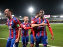 Crystal Palace's Wilfried Zaha celebrates scoring their first goal with teammates on December 16, 2019