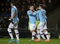 Manchester City's Bernardo Silva and teammates celebrate their second goal scored by Manchester City's Raheem Sterling on December 18, 2019