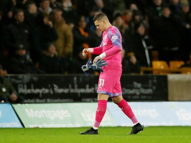 Manchester City's Ederson walks after he is shown a red card by referee Martin Atkinson on December 27, 2019