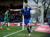 Rochdale's Aaron Wilbraham celebrates scoring their first goal on January 4, 2020