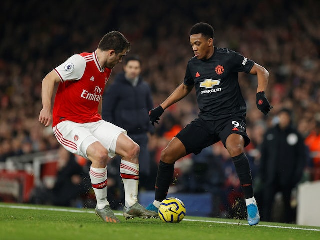 Arsenal's Sokratis in action with Manchester United's Anthony Martial in the Premier League on January 1, 2020