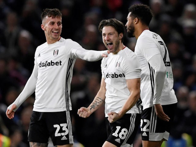 Fulham's Harry Arter celebrates scoring their second goal with Joe Bryan and Cyrus Christie on January 4, 2020