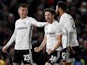 Fulham's Harry Arter celebrates scoring their second goal with Joe Bryan and Cyrus Christie on January 4, 2020