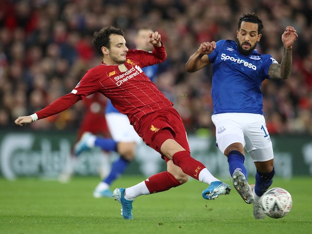 Liverpool's Pedro Chirivella in action with Everton's Theo Walcott in the FA Cup on January 5, 2020