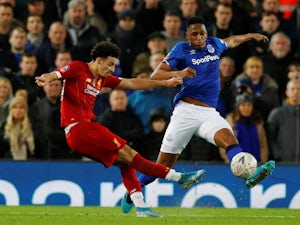 Jones hits stunner as Liverpool edge past Everton