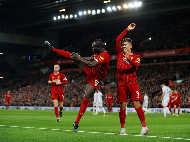 Liverpool's Sadio Mane celebrates scoring their second goal with Roberto Firmino on January 2, 2020