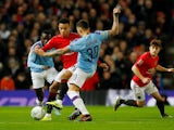 Mason Greenwood and Nicolas Otamendi in action during the EFL Cup game between Manchester United and Manchester City on January 7, 2020