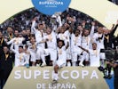 Real Madrid players lift the trophy as they celebrate winning the Super Cup on January 12, 2020