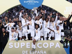 Real Madrid players lift the trophy as they celebrate winning the Super Cup on January 12, 2020