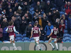 Burnley's Ashley Westwood celebrates scoring their second goal with Phil Bardsley and Jeff Hendrick on January 19, 2020