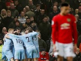 Burnley's Jay Rodriguez celebrates scoring their second goal with teammates as Manchester United's Mason Greenwood looks dejected on January 22, 2020