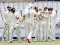 England's Mark Wood celebrates the wicket of South Africa's Dane Paterson with team mates on January 26, 2020