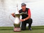 Australia's Lucas Herbert celebrates winning the Dubai Desert Classic with the trophy on January 26, 2020