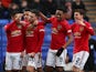 Manchester United's Diogo Dalot celebrates scoring their second goal with teammates on January 26, 2020