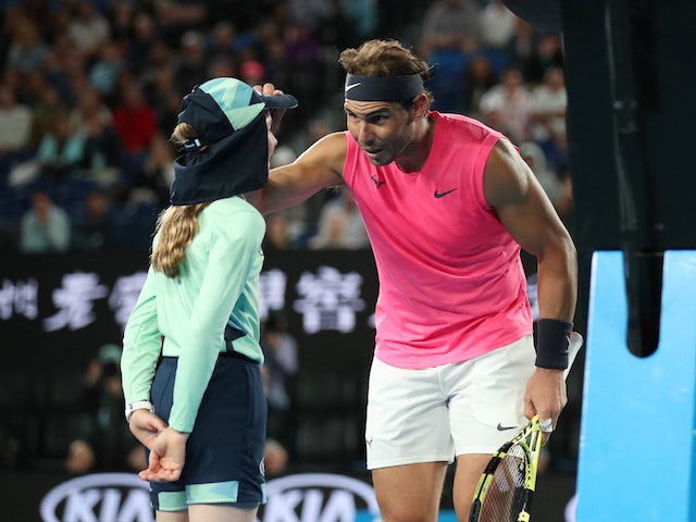 Rafael Nadal apologises with a kiss after hitting ball girl