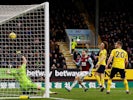 Burnley's Jay Rodriguez shoots against the crossbar as Arsenal's Bernd Leno attempts to save on February 2, 2020